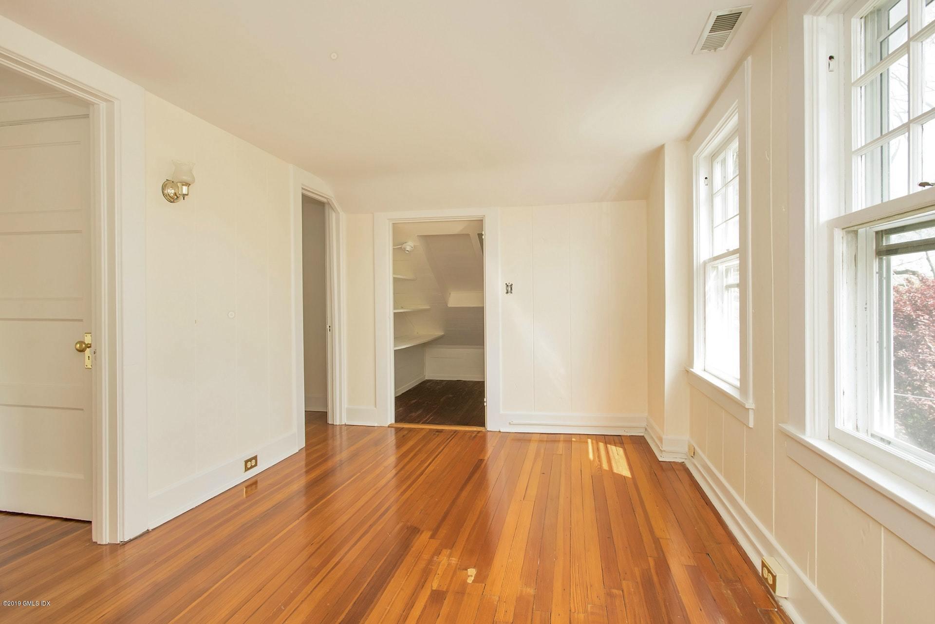 17 Ballwood Road Old Greenwich, CT 06870 - Photo 23 of 36 a view of a room with wooden floor and a window