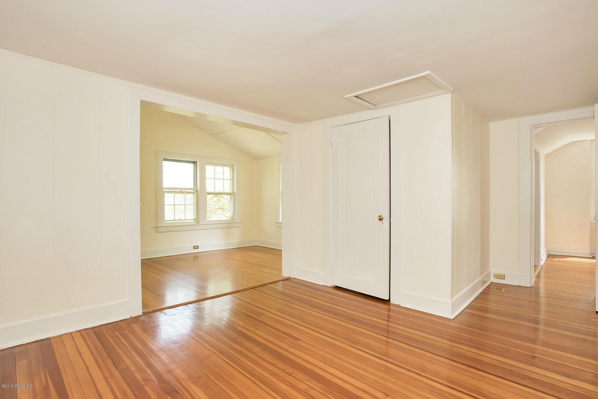 17 Ballwood Road Old Greenwich, CT 06870 - Photo 24 of 36 a view of empty room with wooden floor and fan
