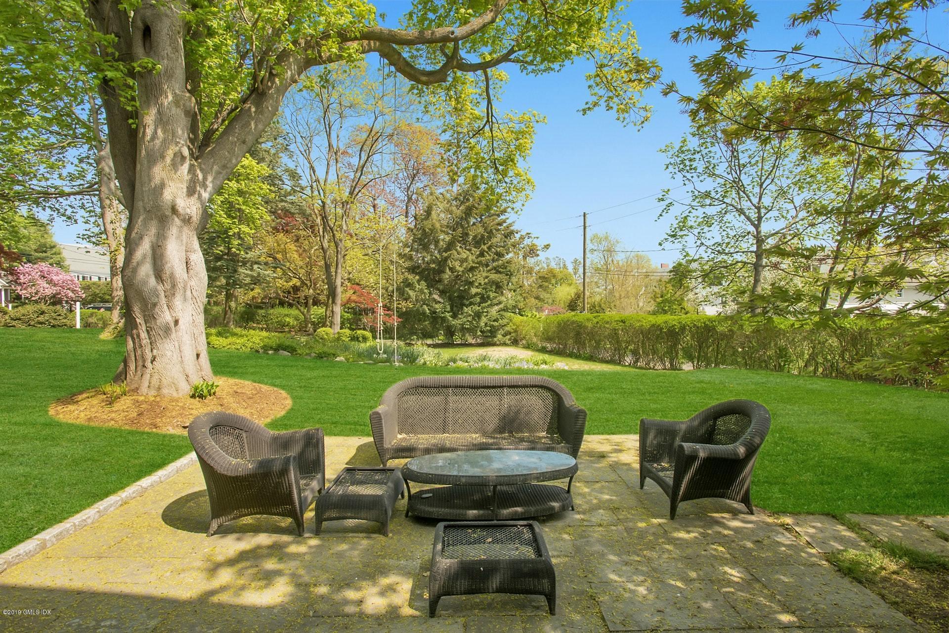 17 Ballwood Road Old Greenwich, CT 06870 - Photo 3 of 36 a view of a table and chairs in the garden