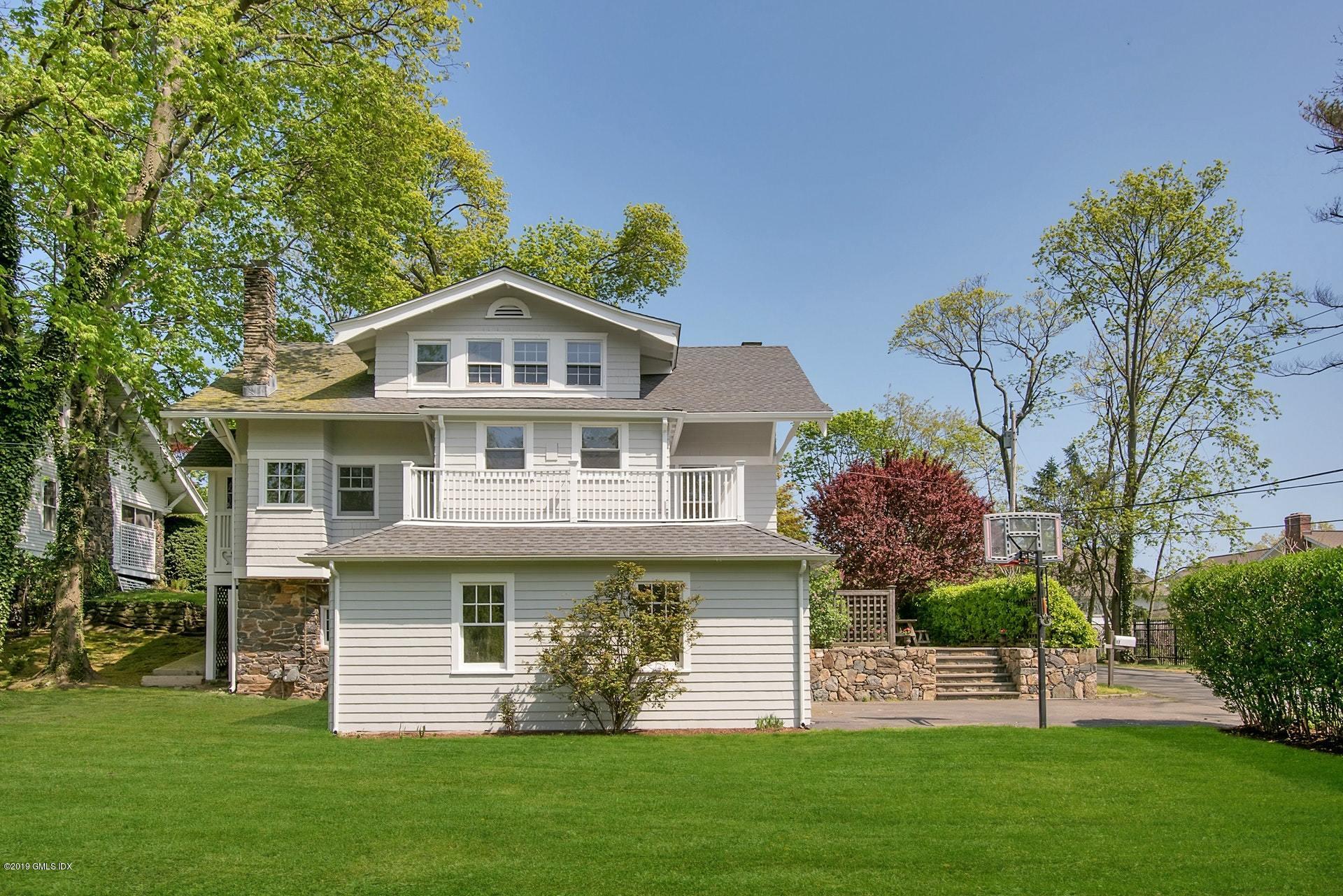 17 Ballwood Road Old Greenwich, CT 06870 - Photo 31 of 36 a front view of a house with a garden