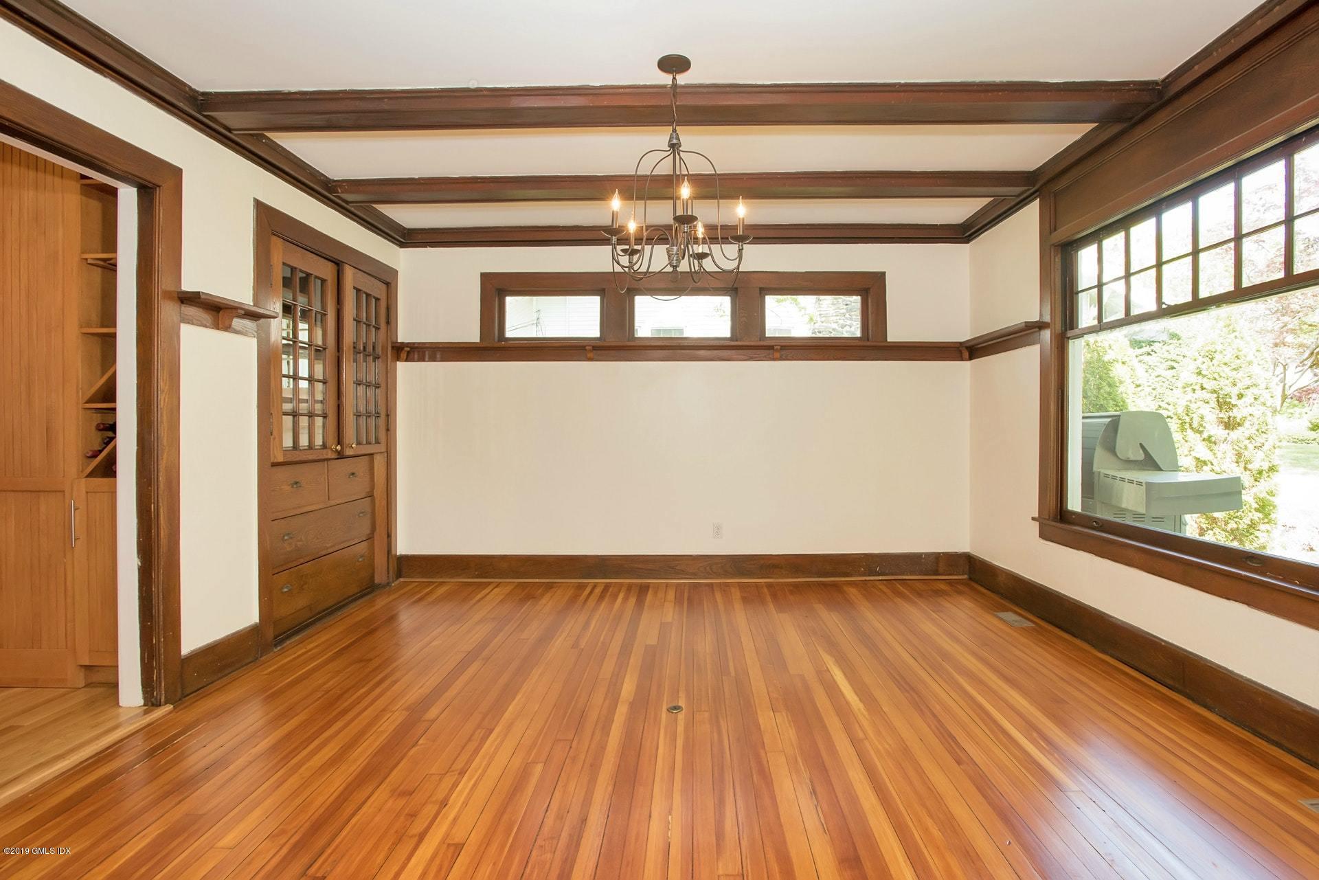17 Ballwood Road Old Greenwich, CT 06870 - Photo 5 of 36 a view of empty room with wooden floor and fan
