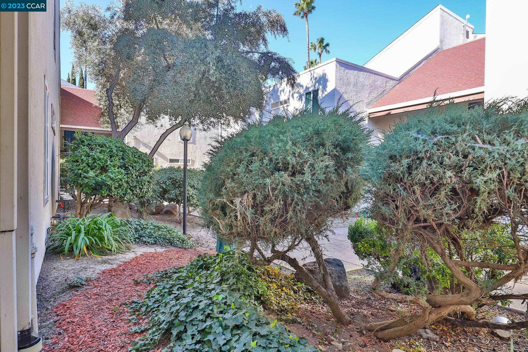 2500 Laguna Circle, Unit C Concord, CA 94520 - Photo 10 of 13 a view of a yard in front of a house