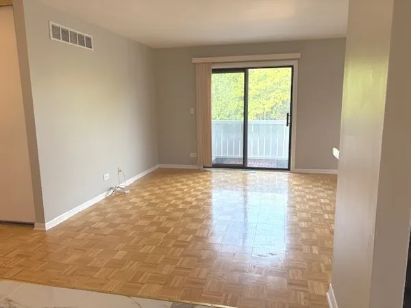 a view of an empty room and window