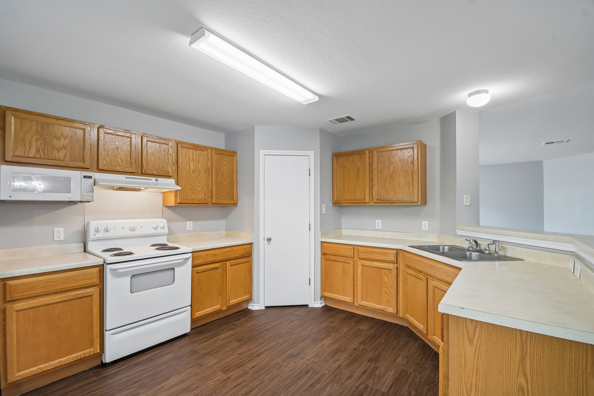 610 Lavaca Loop Elgin, TX 78621 - Photo 9 of 37 Functional kitchen with ample cabinetry and generous counter space for meal preparation.