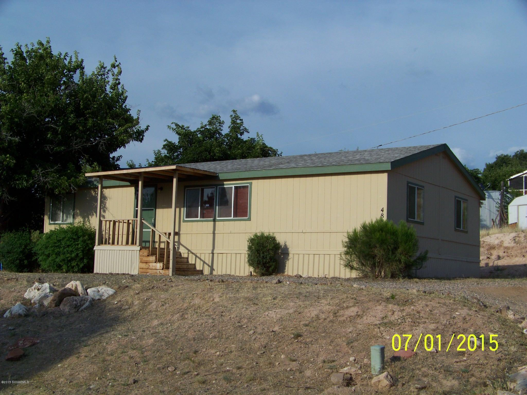 4885 North Gone Fishin Road Rimrock, AZ 86335 - Photo 1 of 17 a view of a house with backyard and plants