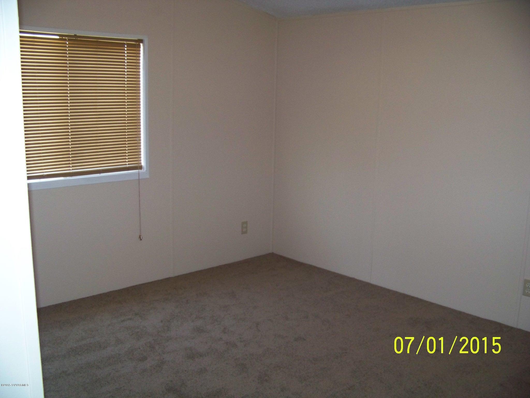 4885 North Gone Fishin Road Rimrock, AZ 86335 - Photo 11 of 17 a view of an empty room with a window