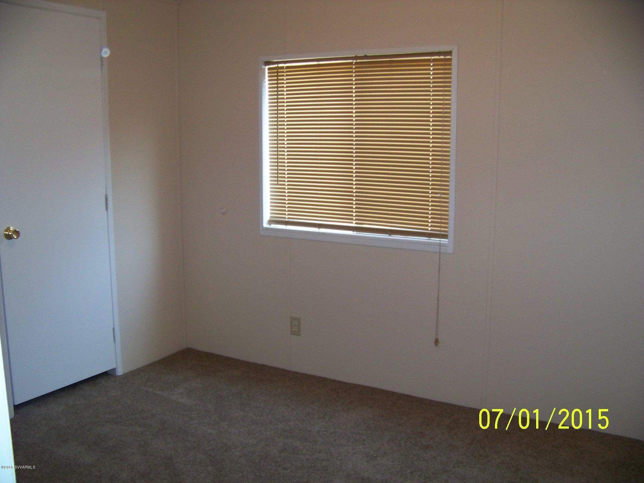 4885 North Gone Fishin Road Rimrock, AZ 86335 - Photo 12 of 17 an empty room with a window