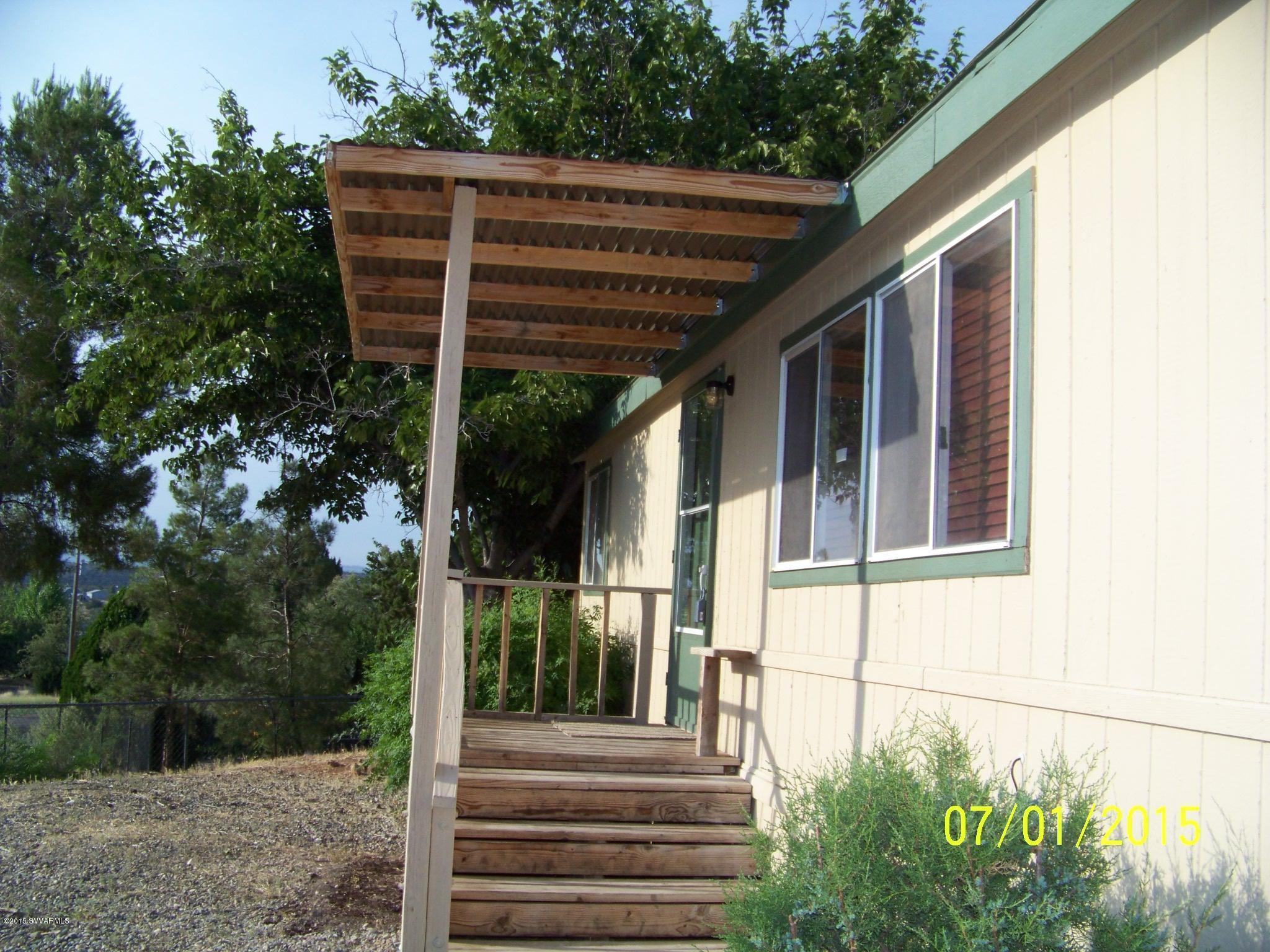 4885 North Gone Fishin Road Rimrock, AZ 86335 - Photo 16 of 17 a view of a house with backyard and porch