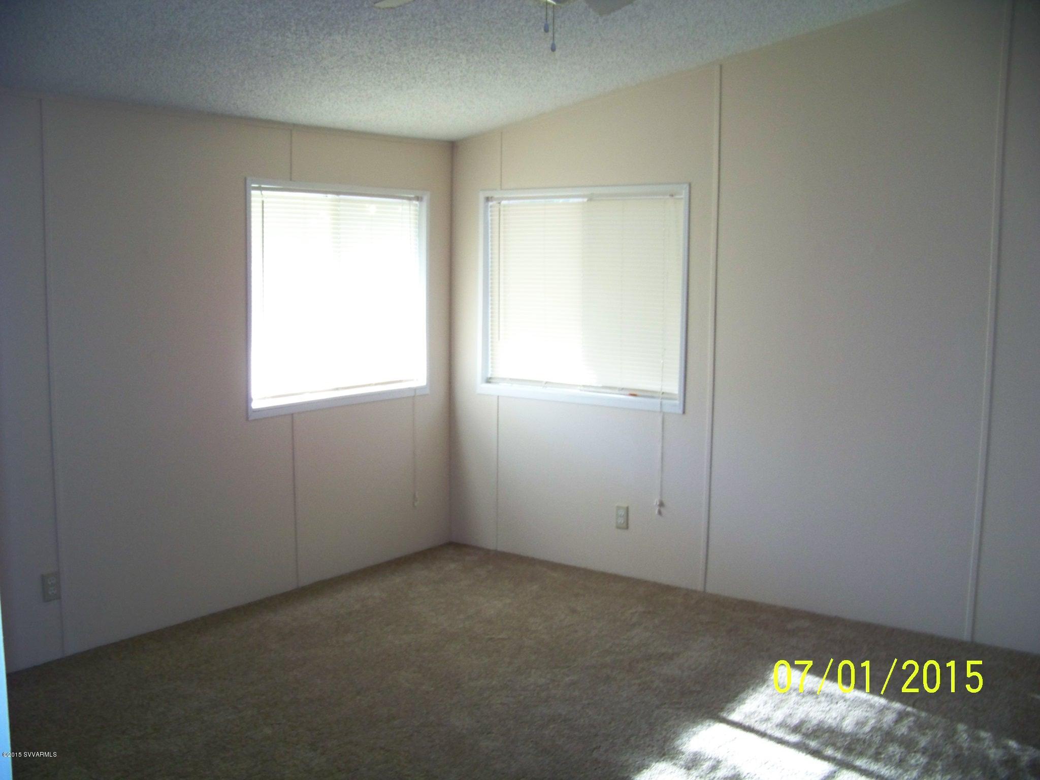 4885 North Gone Fishin Road Rimrock, AZ 86335 - Photo 6 of 17 an empty room with a window