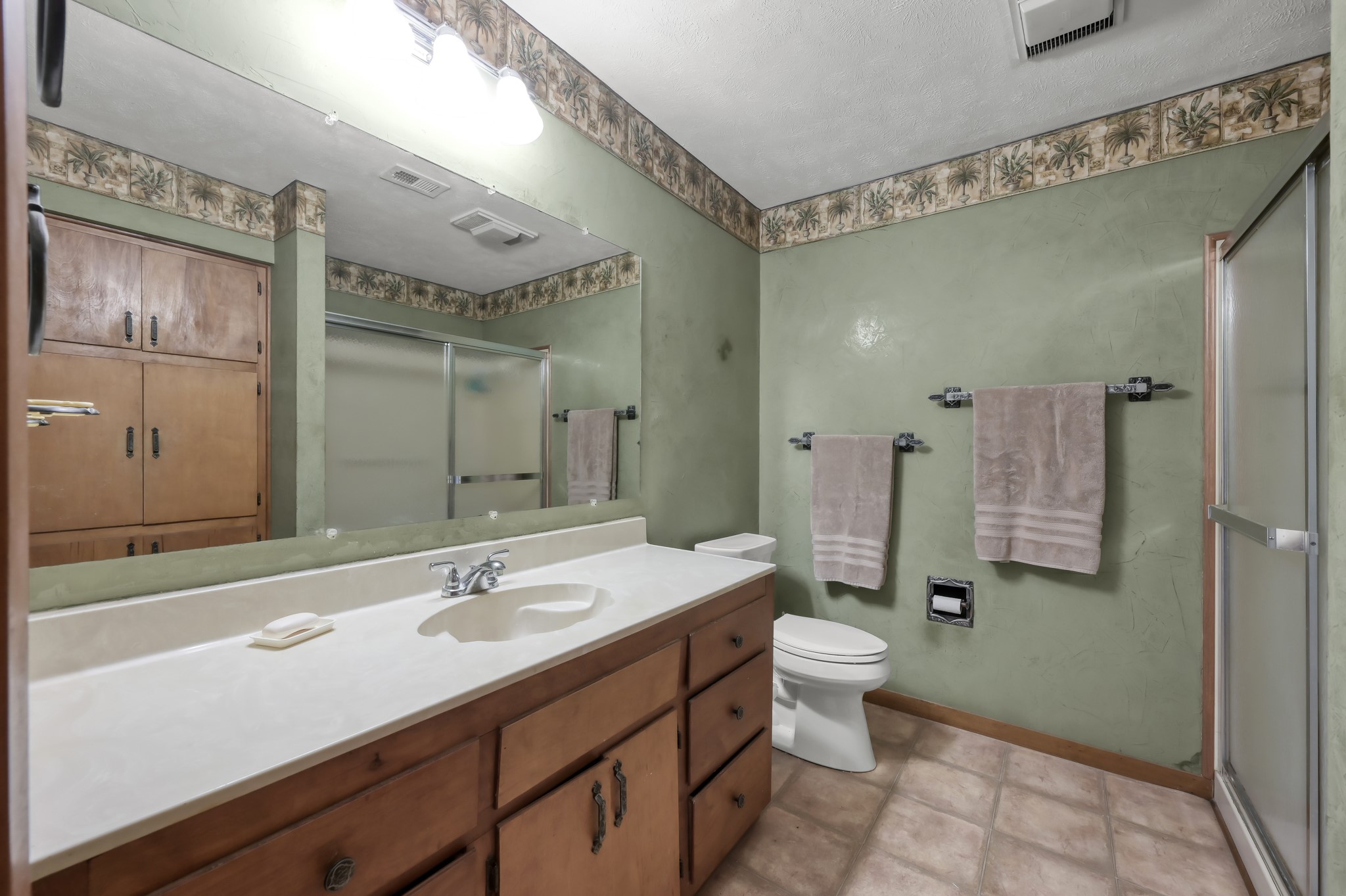 254 Sharp Lane Trinity, TX 75862 - Photo 23 of 36 a bathroom with a double vanity sink mirror and toilet