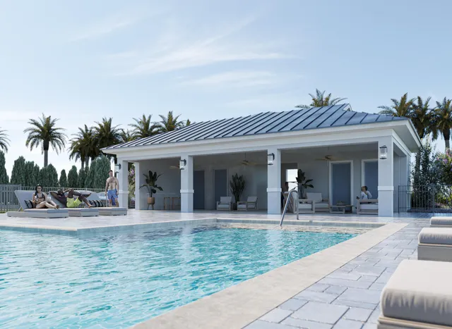 a view of a swimming pool with a patio and a garden