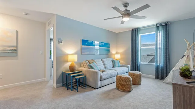 a living room with furniture and a lamp