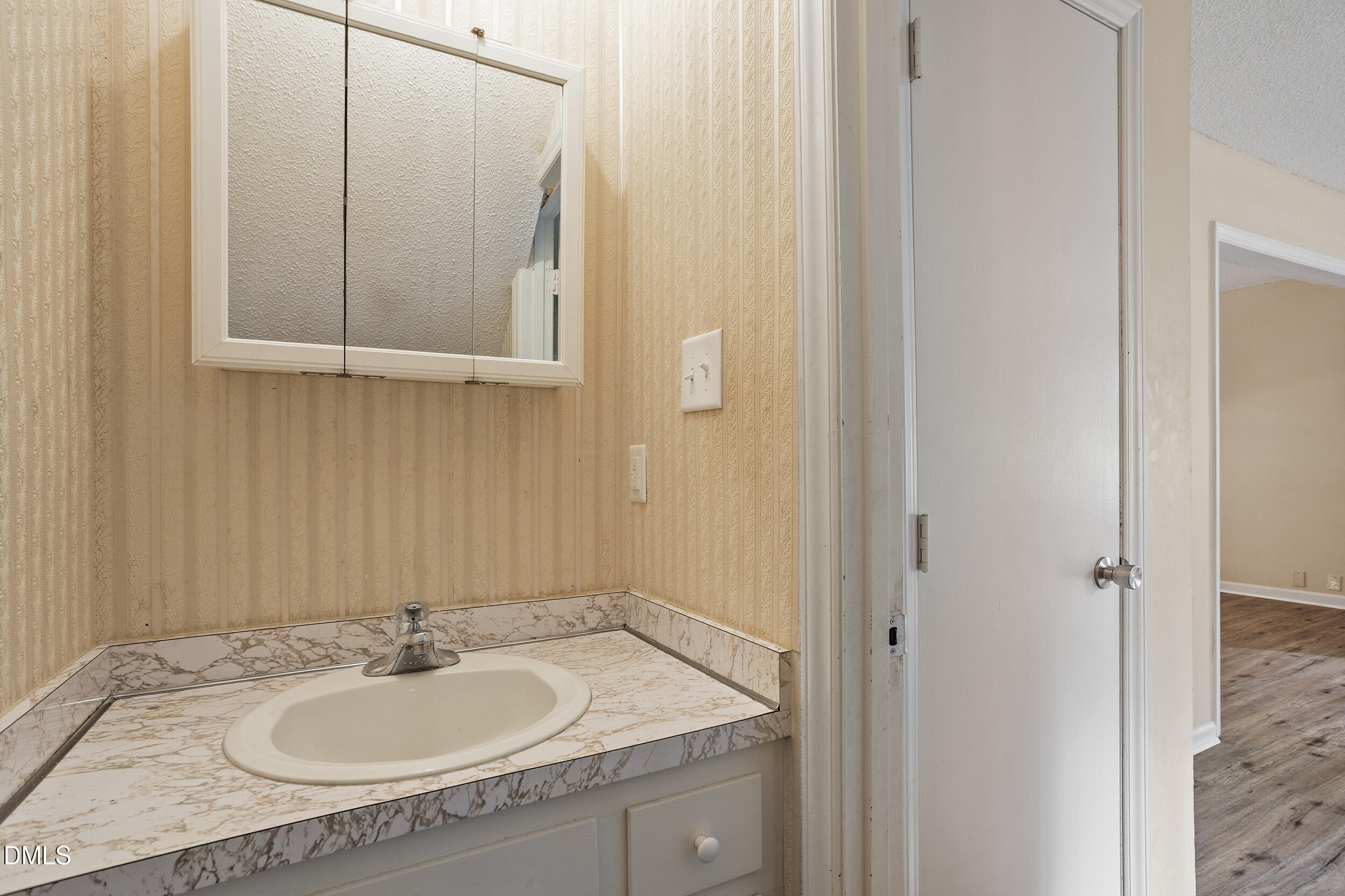 1801 Quail Ridge Road Raleigh, NC 27609 - Photo 8 of 29 a bathroom with a granite countertop sink and a mirror
