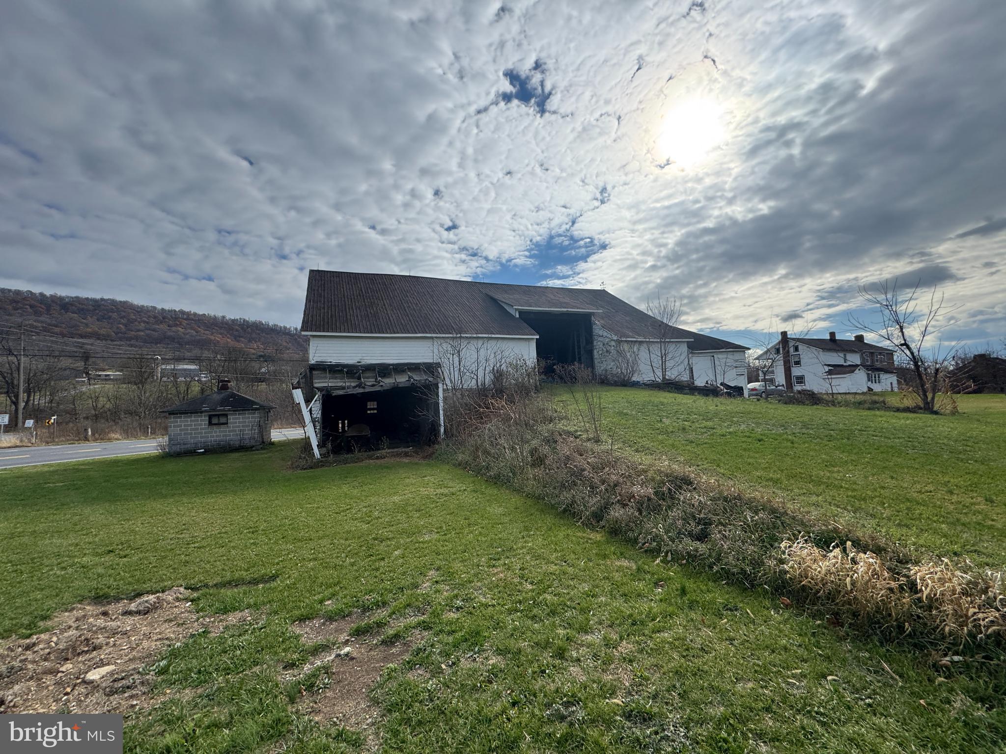 1-19032 Spring Run Rd Spring Run Spring Run, PA 17262 - Photo 27 of 79 a view of a backyard with plants and a fireplace