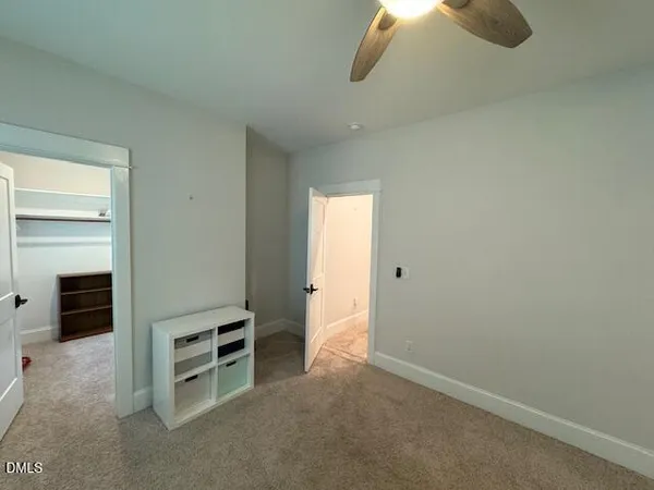 a view of empty room with fireplace