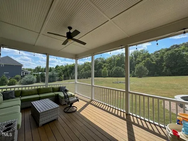 a view of a two chairs in the balcony