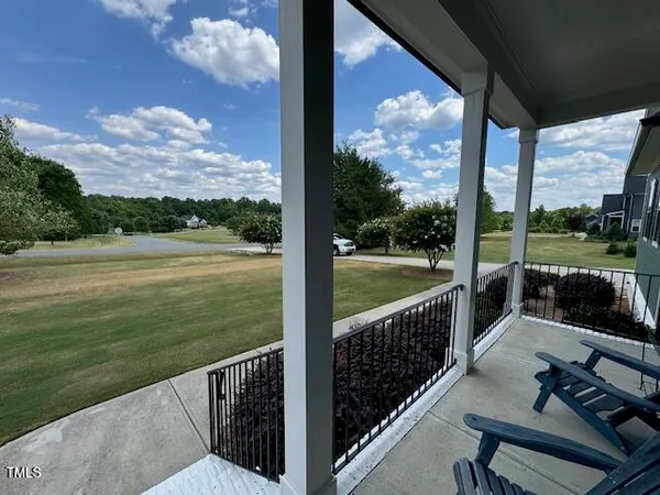 a view of a porch with a yard