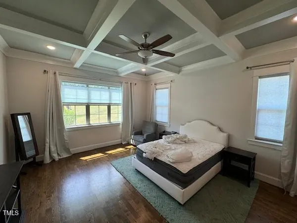 a bedroom with furniture and a window