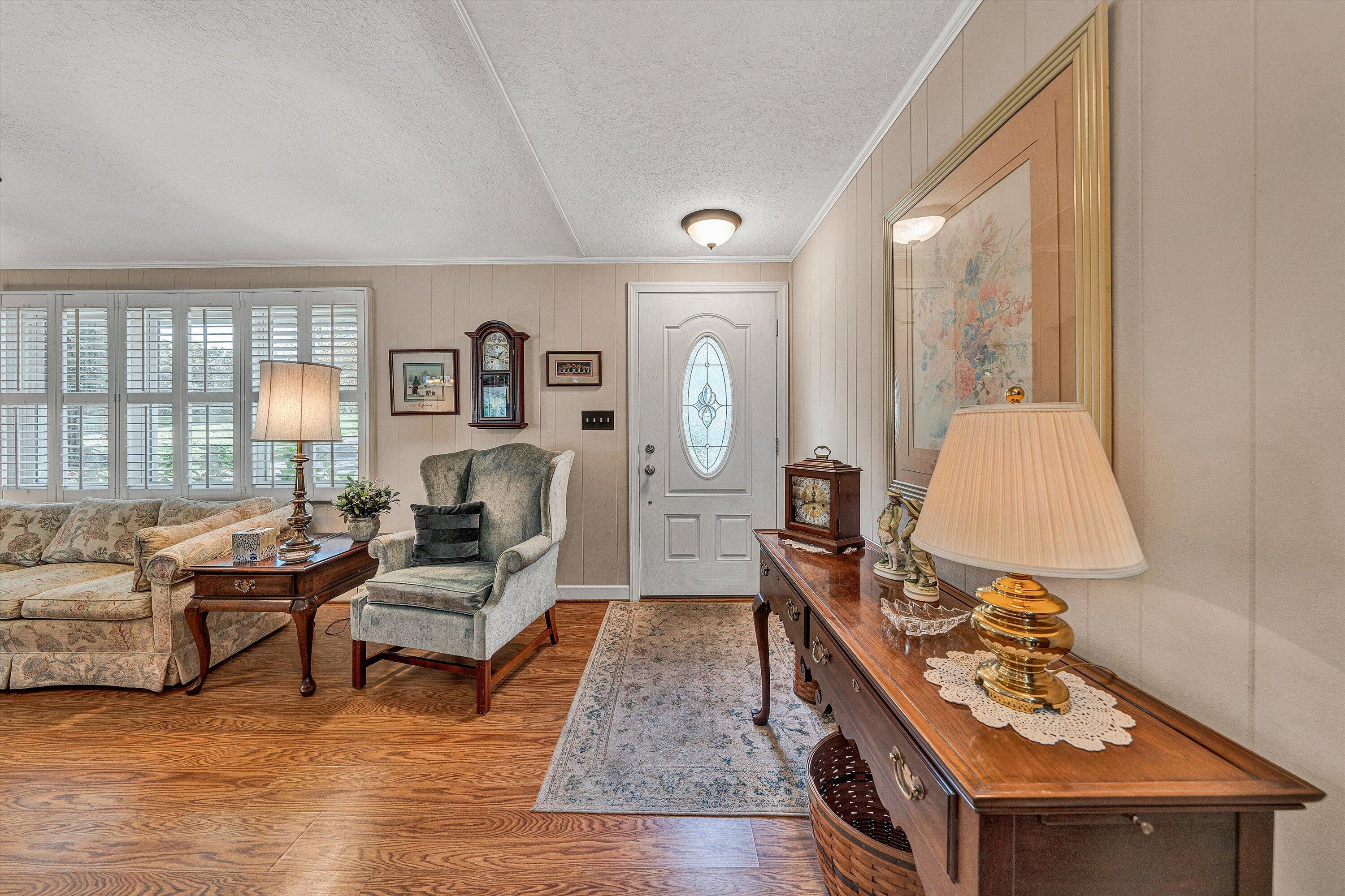 151 Twin Oaks Road Wirtz, VA 24184 - Photo 11 of 41 a living room with furniture and a flat screen tv