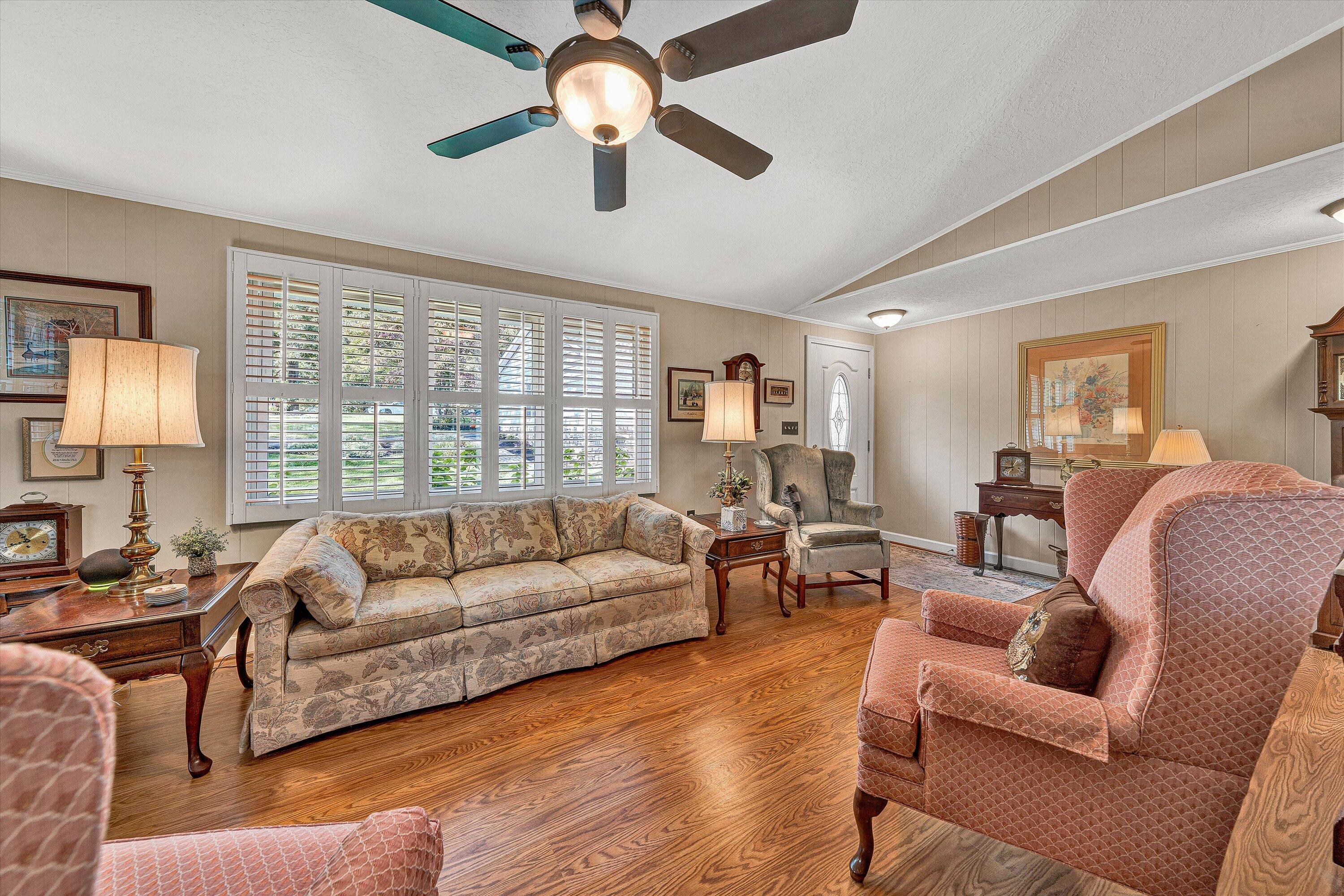 151 Twin Oaks Road Wirtz, VA 24184 - Photo 13 of 41 a living room with furniture ceiling fan and a large window