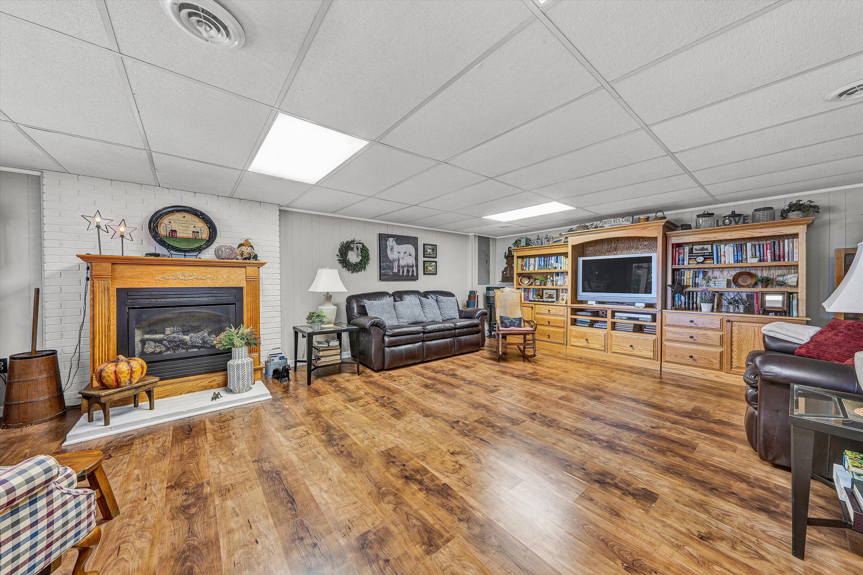 151 Twin Oaks Road Wirtz, VA 24184 - Photo 30 of 41 a living room with furniture and a fireplace