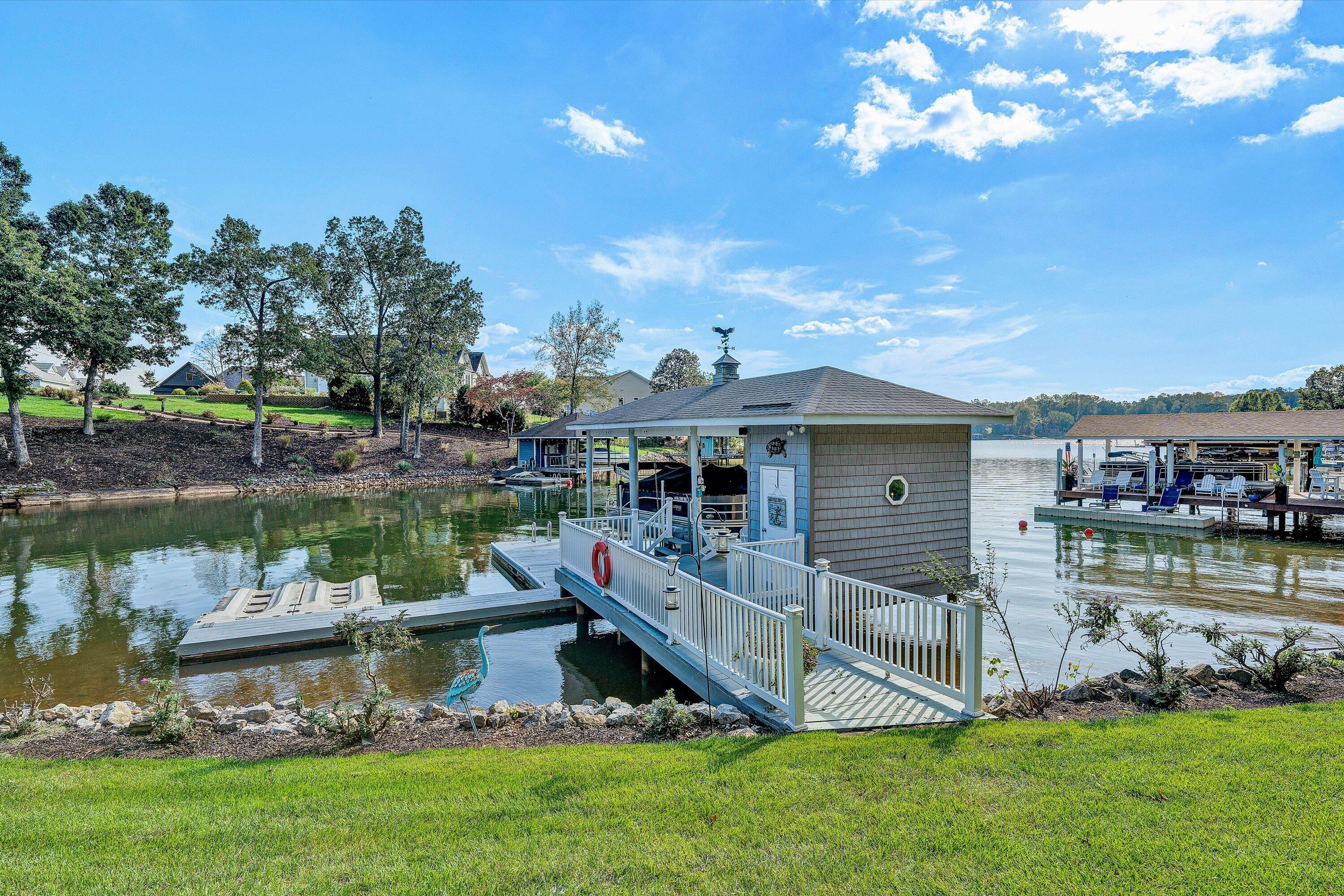 151 Twin Oaks Road Wirtz, VA 24184 - Photo 3 of 41 a view of a house with a yard from a lake