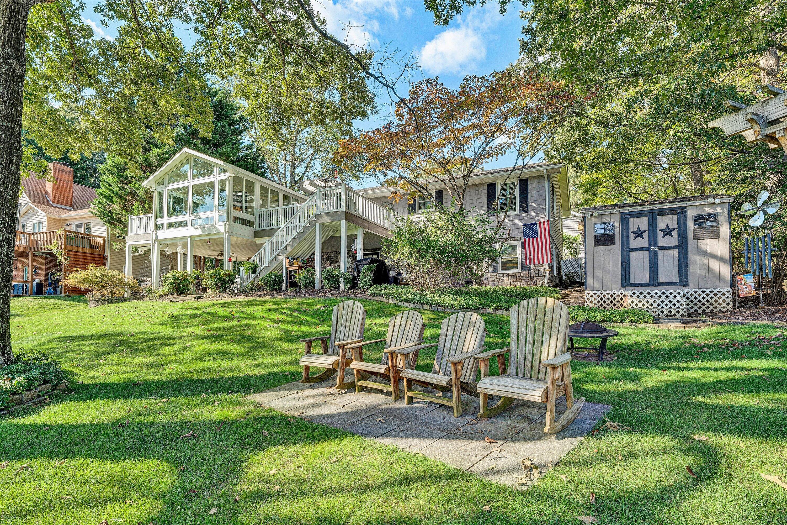 151 Twin Oaks Road Wirtz, VA 24184 - Photo 10 of 41 a view of a house with a yard and sitting area