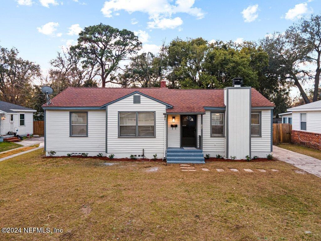 1720 Lilly Road East Jacksonville, FL 32207 - Photo 1 of 33 a front view of a house with a yard