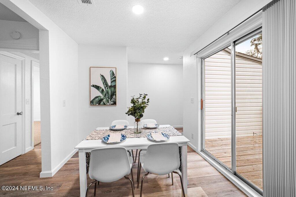 1720 Lilly Road East Jacksonville, FL 32207 - Photo 15 of 33 a dining room with furniture and window