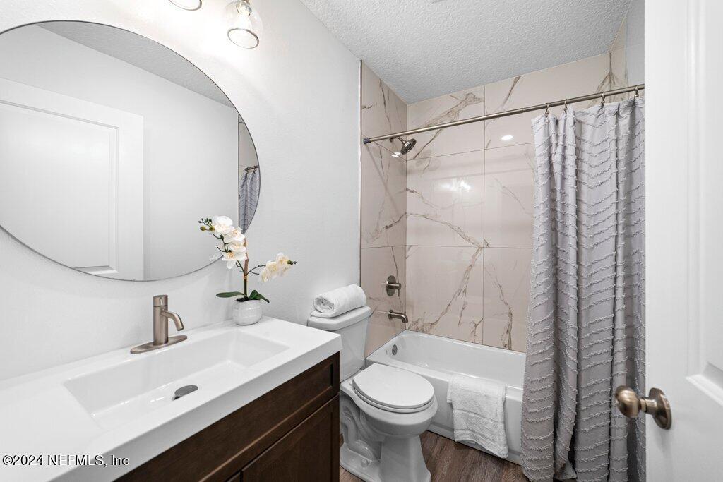 1720 Lilly Road East Jacksonville, FL 32207 - Photo 18 of 33 a bathroom with a sink toilet and shower