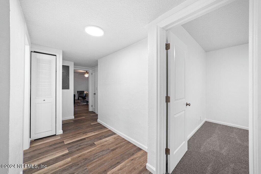 1720 Lilly Road East Jacksonville, FL 32207 - Photo 20 of 33 a view of a hallway with wooden floor and closet