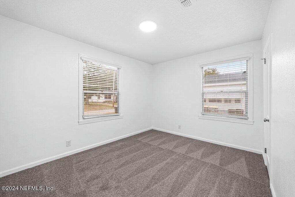 1720 Lilly Road East Jacksonville, FL 32207 - Photo 22 of 33 an empty room with a window