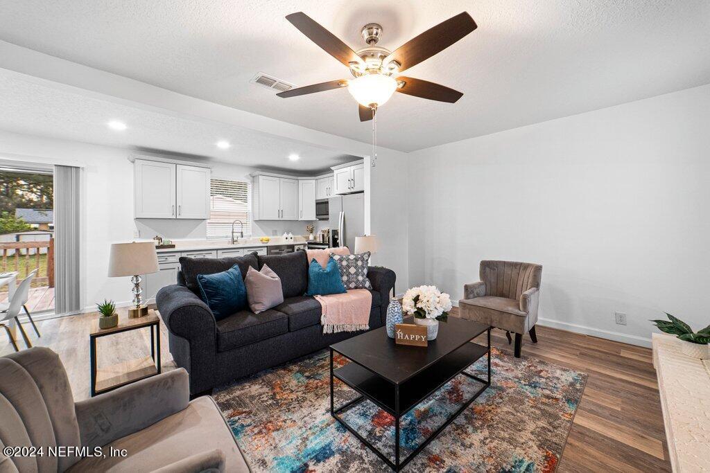 1720 Lilly Road East Jacksonville, FL 32207 - Photo 4 of 33 a living room with furniture and kitchen view