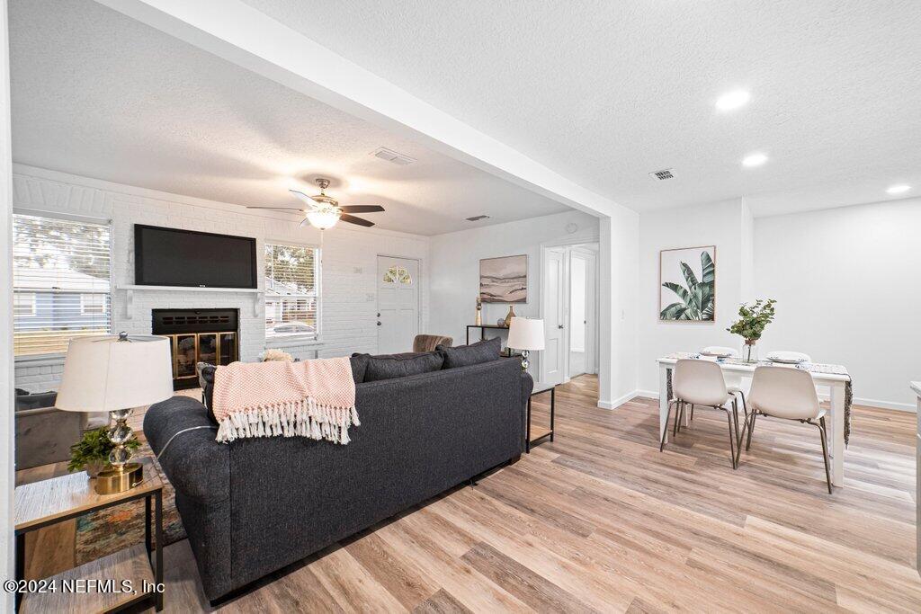 1720 Lilly Road East Jacksonville, FL 32207 - Photo 10 of 33 a living room with furniture and a fireplace