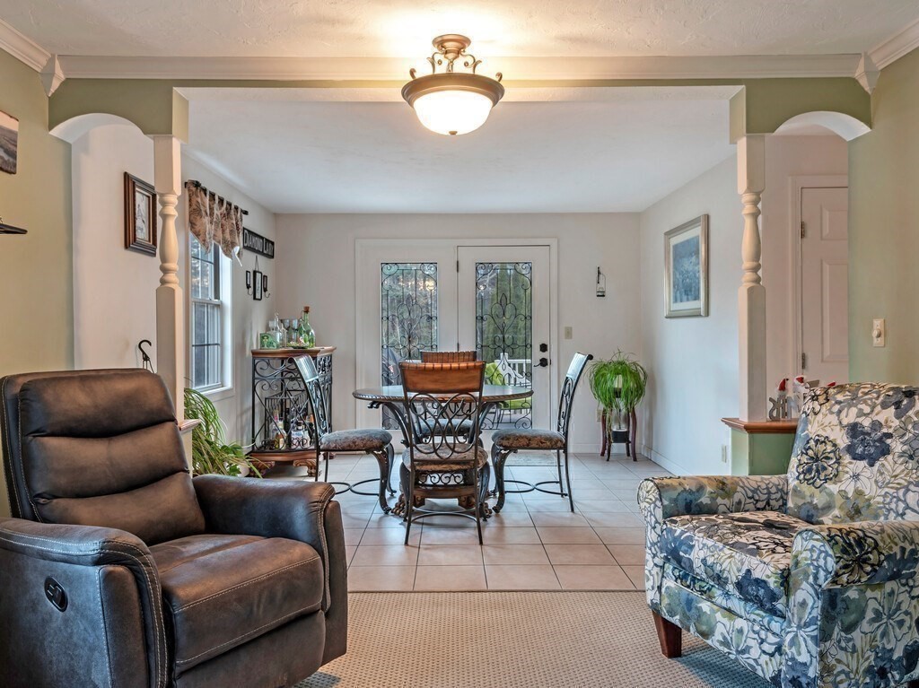 86 Mason Road Townsend, MA 01474 - Photo 17 of 41 a living room with furniture and a chandelier