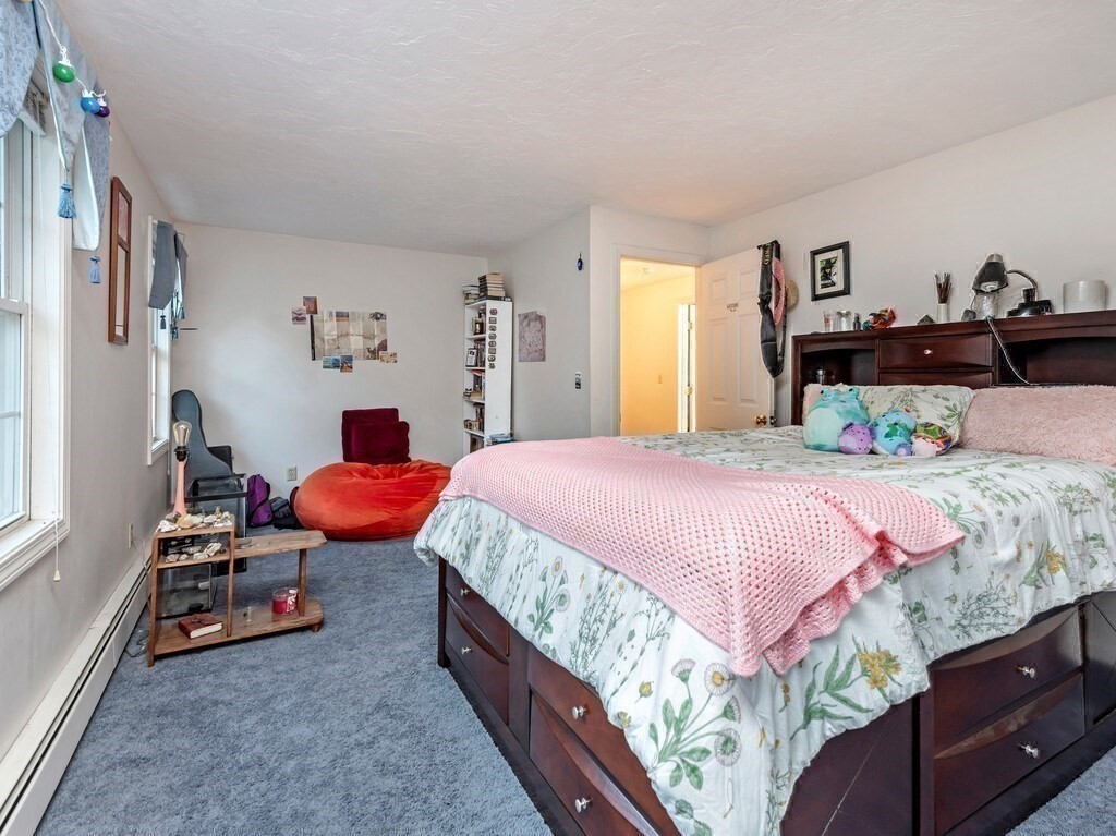 86 Mason Road Townsend, MA 01474 - Photo 25 of 41 a bedroom with a bed and a couch