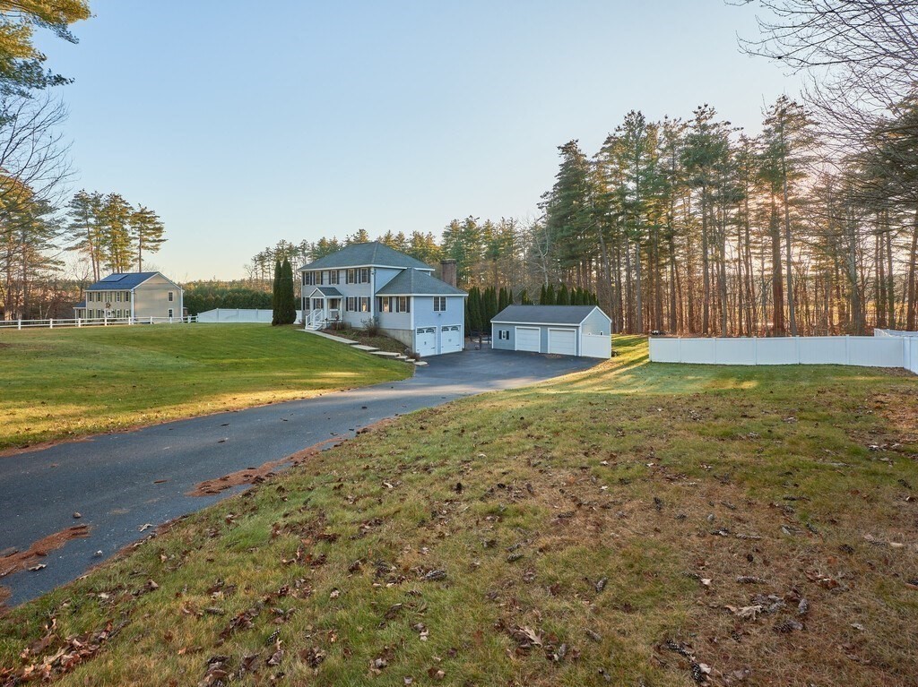 86 Mason Road Townsend, MA 01474 - Photo 3 of 41 a view of a house with a yard and sitting area