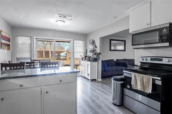 a kitchen with a stove and a refrigerator