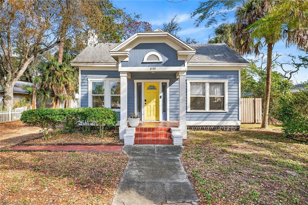 2149 Stella Street Fort Myers, FL 33901 - Photo 1 of 43 a front view of a house with a yard