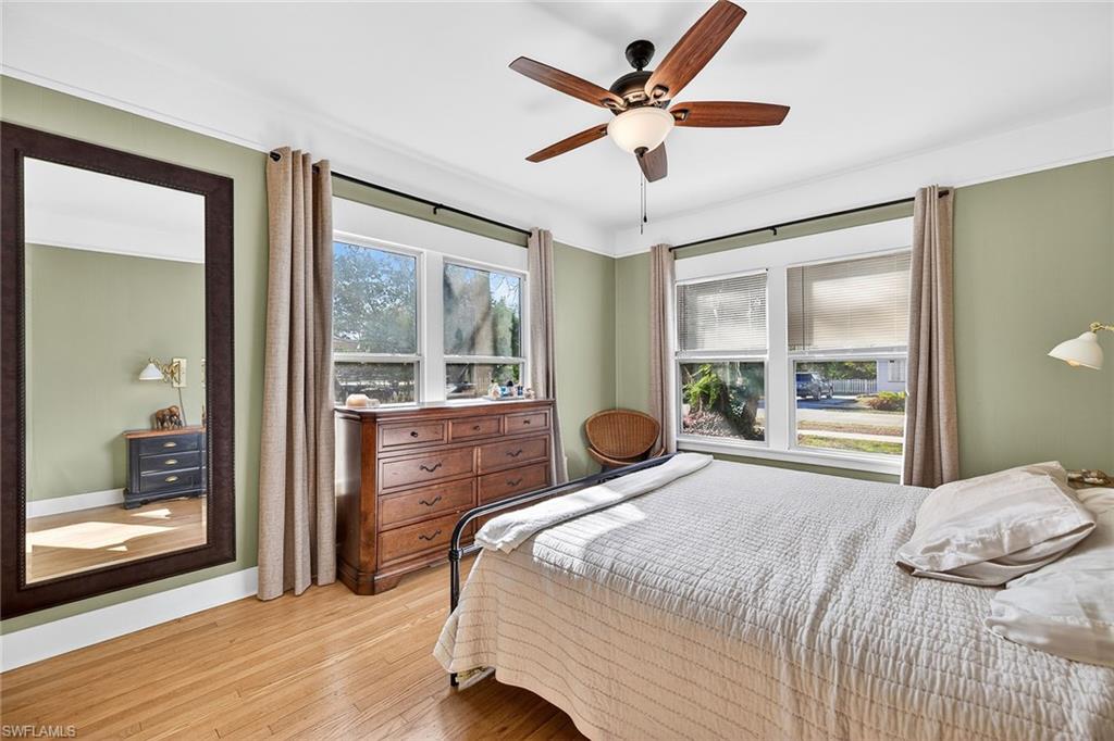 2149 Stella Street Fort Myers, FL 33901 - Photo 16 of 43 a bedroom with a large bed and a large window