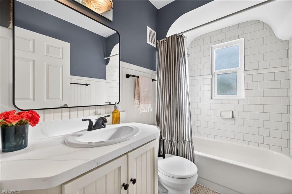 2149 Stella Street Fort Myers, FL 33901 - Photo 18 of 43 a bathroom with a sink toilet vanity and shower