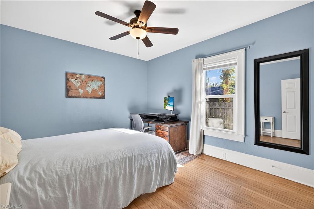 2149 Stella Street Fort Myers, FL 33901 - Photo 19 of 43 a bedroom with a bed and a chandelier