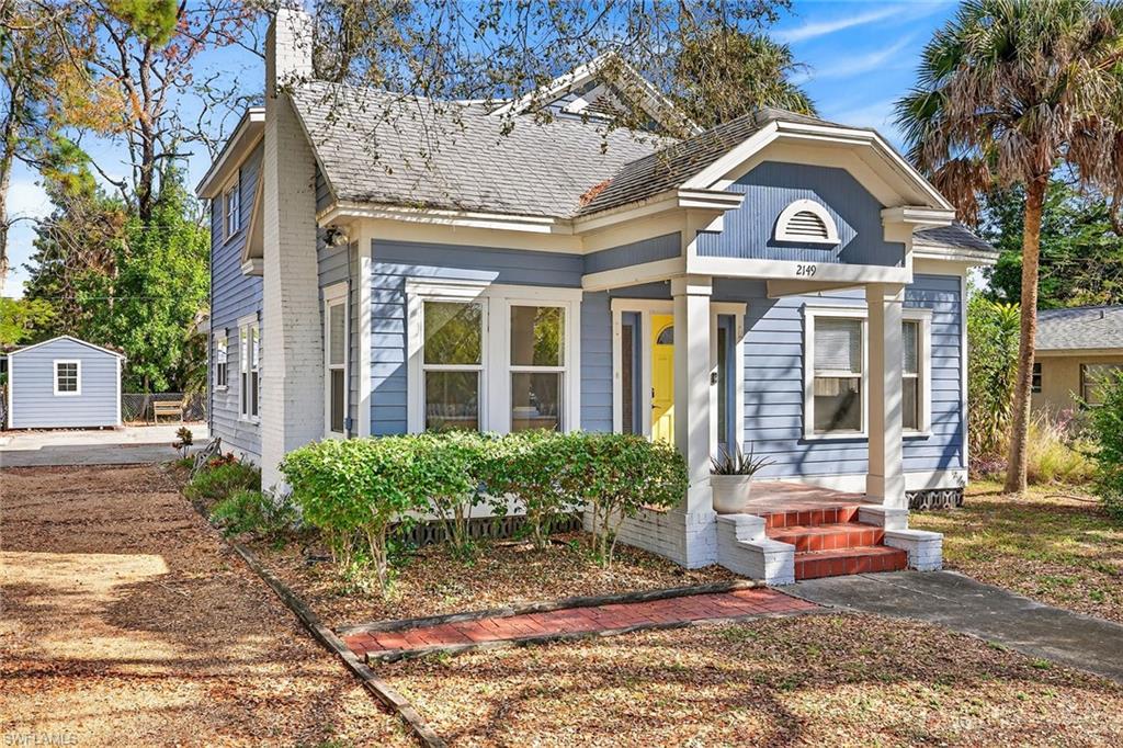2149 Stella Street Fort Myers, FL 33901 - Photo 2 of 43 a front view of a house with a yard