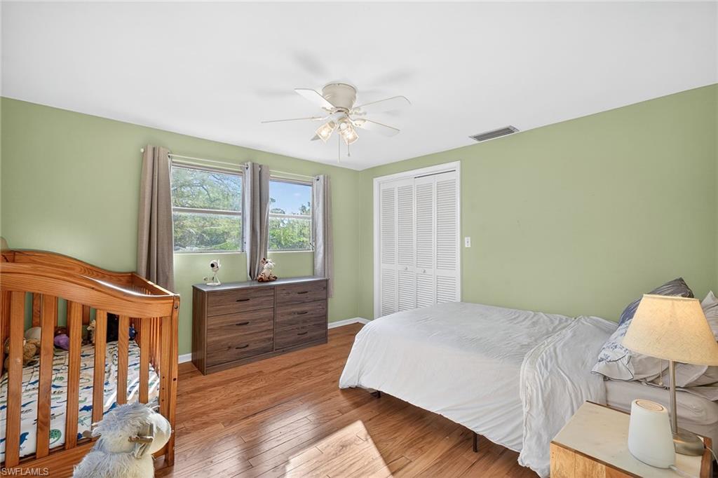 2149 Stella Street Fort Myers, FL 33901 - Photo 21 of 43 a spacious bedroom with a bed and a table
