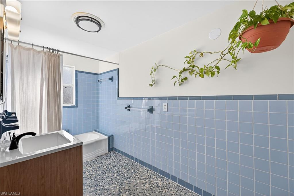 2149 Stella Street Fort Myers, FL 33901 - Photo 26 of 43 a bathroom with a sink a vanity and a mirror