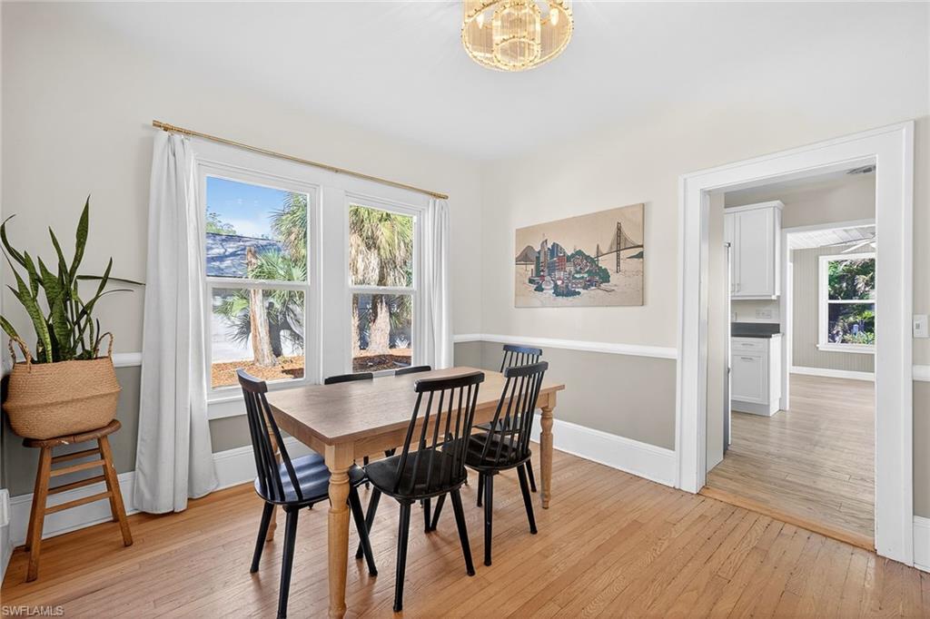 2149 Stella Street Fort Myers, FL 33901 - Photo 9 of 43 a view of a dining room with furniture window and wooden floor