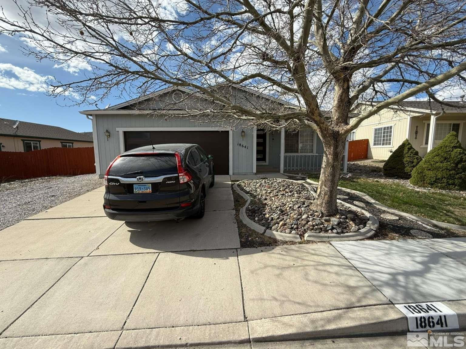 18641 Jutewood Court Reno, NV 89508 - Photo 1 of 12 a view of a car parked in front of house