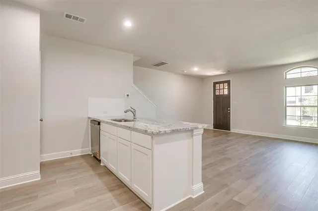 a kitchen with a stove and a sink