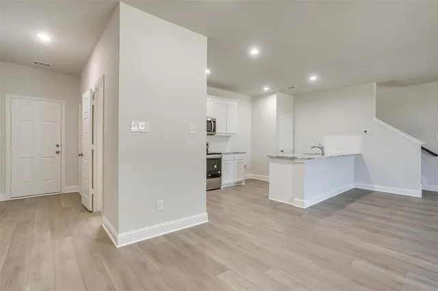 a view of kitchen with wooden floor