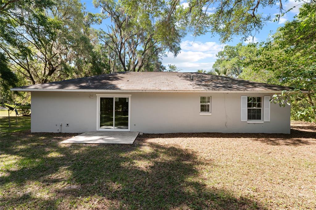 4329 Northwest 155th Street Reddick, FL 32686 - Photo 47 of 52 a house that has a tree in front of it